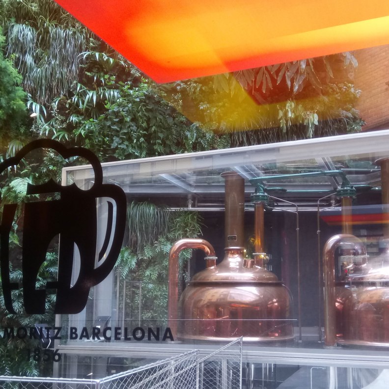 Jean Nouvel Fabrica Moritz vintage beer tanks near green vertical garden by Patrick Blanc